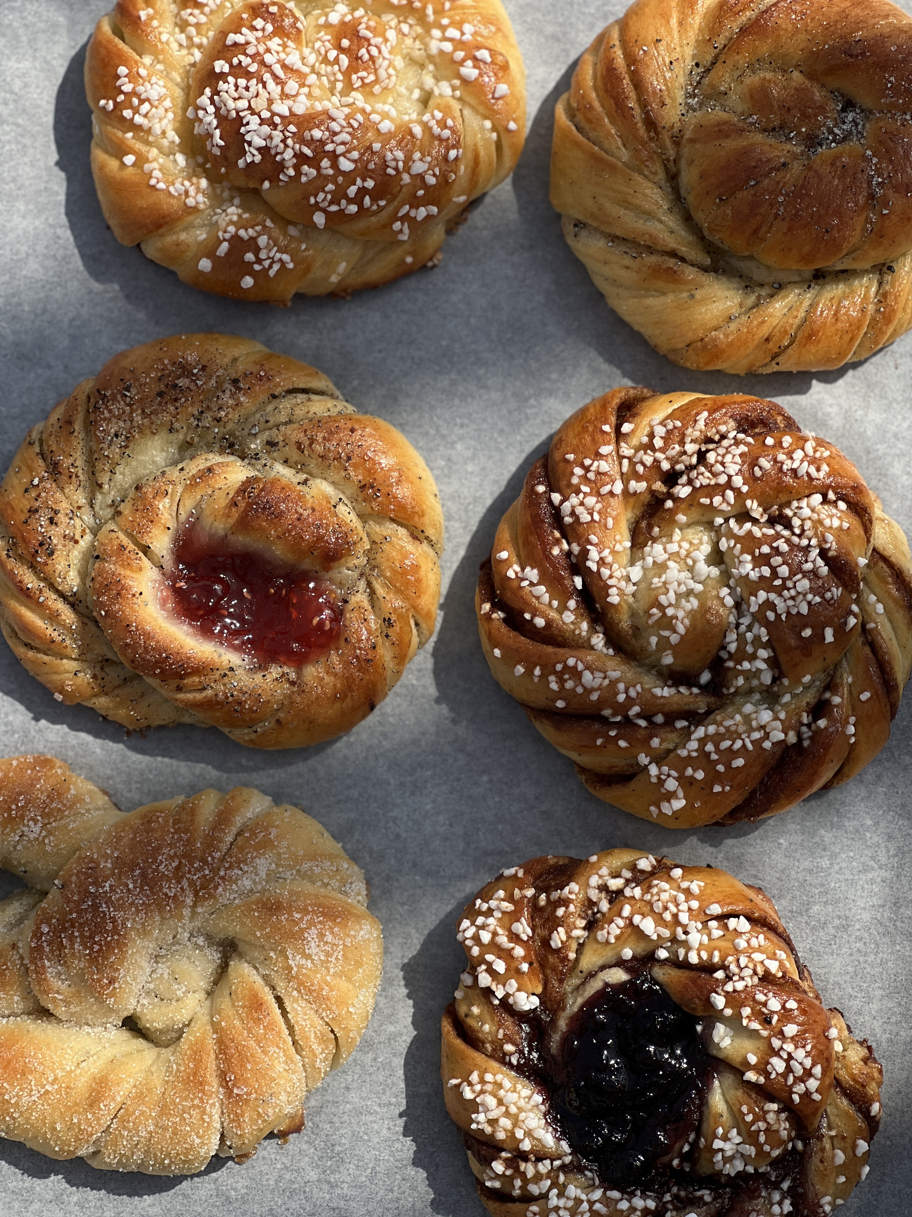 Fresh Swedish kanelbullar cinnamon buns on a tray